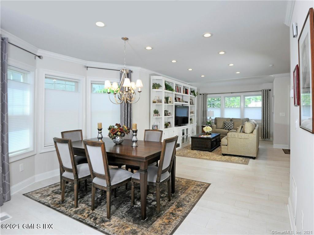 18 William Street, Unit WEST Greenwich, CT 06830 - Photo 4 of 21 a view of a dining room with furniture and a potted plant
