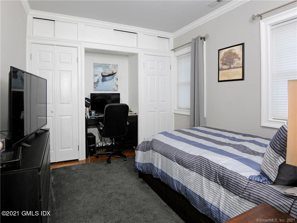 18 William Street, Unit WEST Greenwich, CT 06830 - Photo 10 of 21 a bedroom with bed and tv