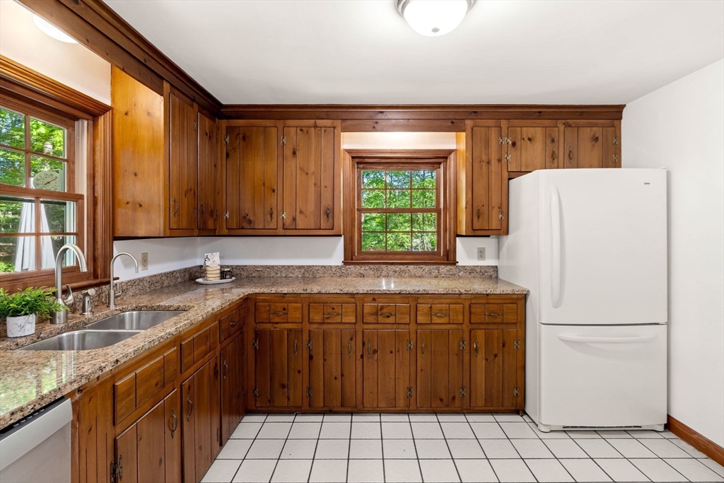 371 Longley Road Groton, MA 01450 - Photo 11 of 33 a kitchen with a sink a refrigerator and a stove
