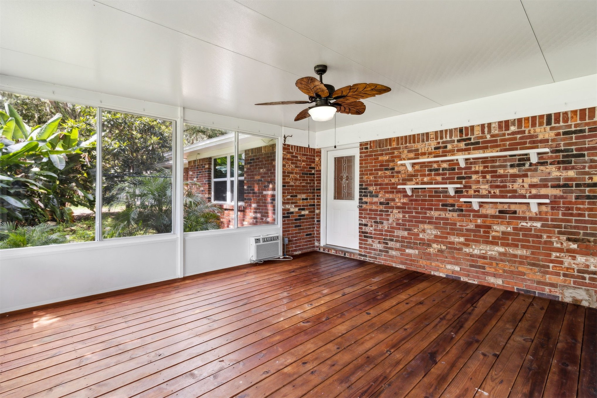 2441 Amelia Road Fernandina Beach, FL 32034 - Photo 8 of 36 an empty room with wooden floor and windows
