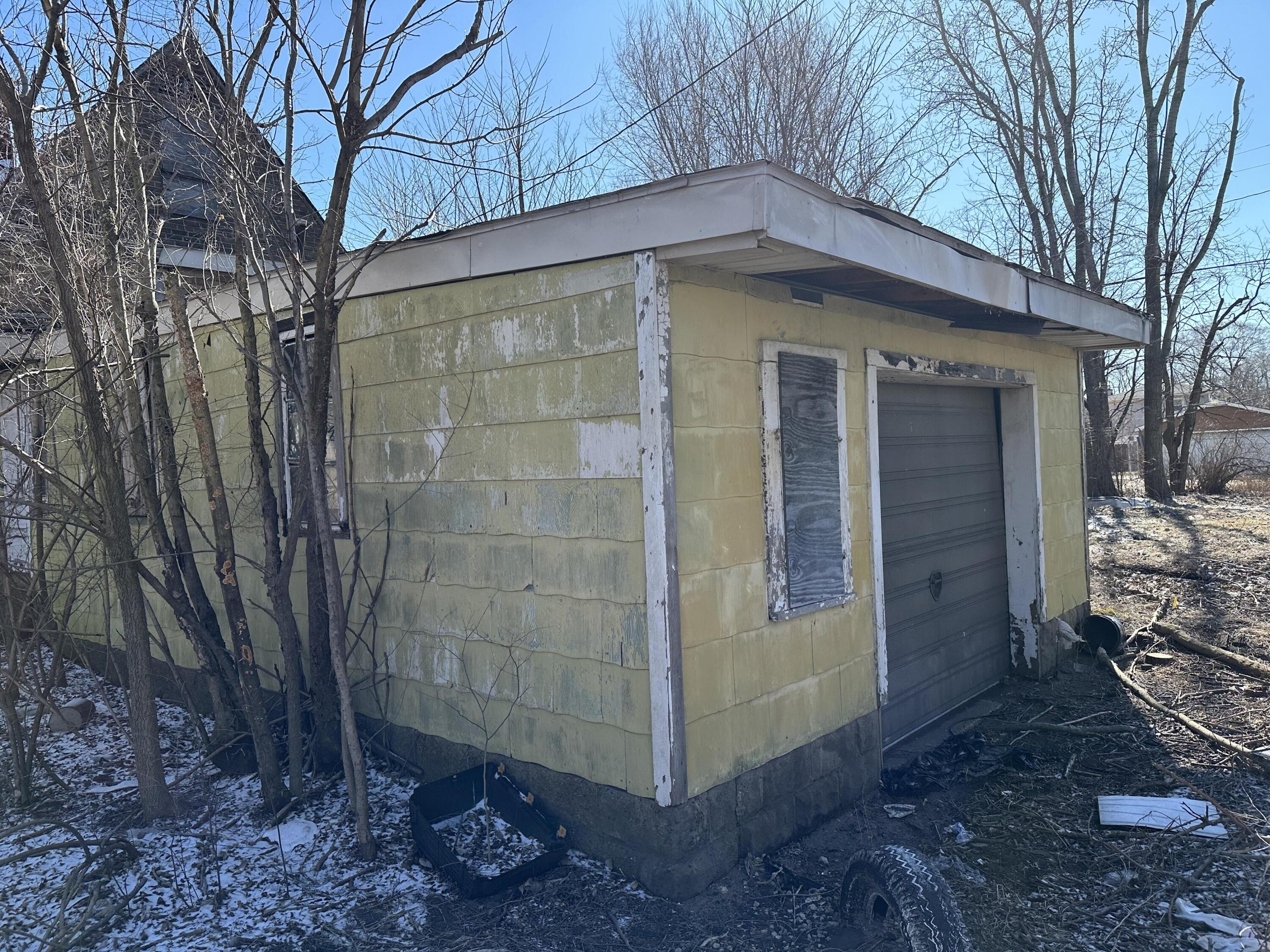 160 Clark Road Gary, IN 46406 - Photo 13 of 16 a front view of a house with garden