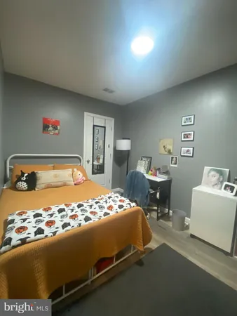 a bedroom with a bed and a table in it