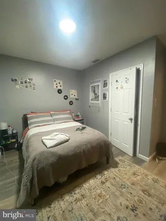 a bedroom with a bed and a view of bathroom