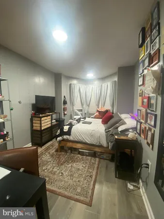 a bedroom with a bed and a couch