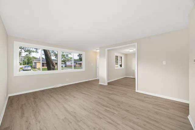 a kitchen with granite countertop a sink cabinets stainless steel appliances and a counter space