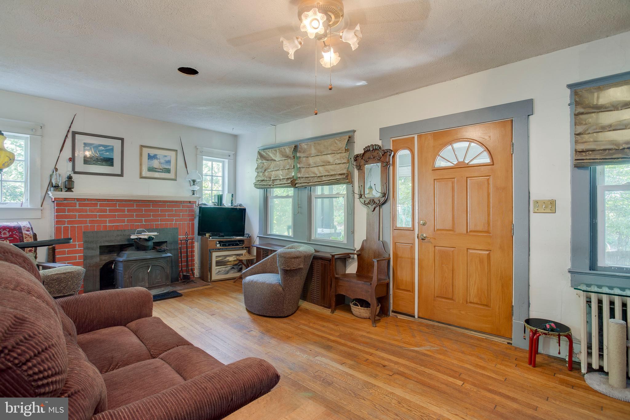 730 Londontown Road Edgewater, MD 21037 - Photo 7 of 43 Main family room w/woodfloors and wood stove