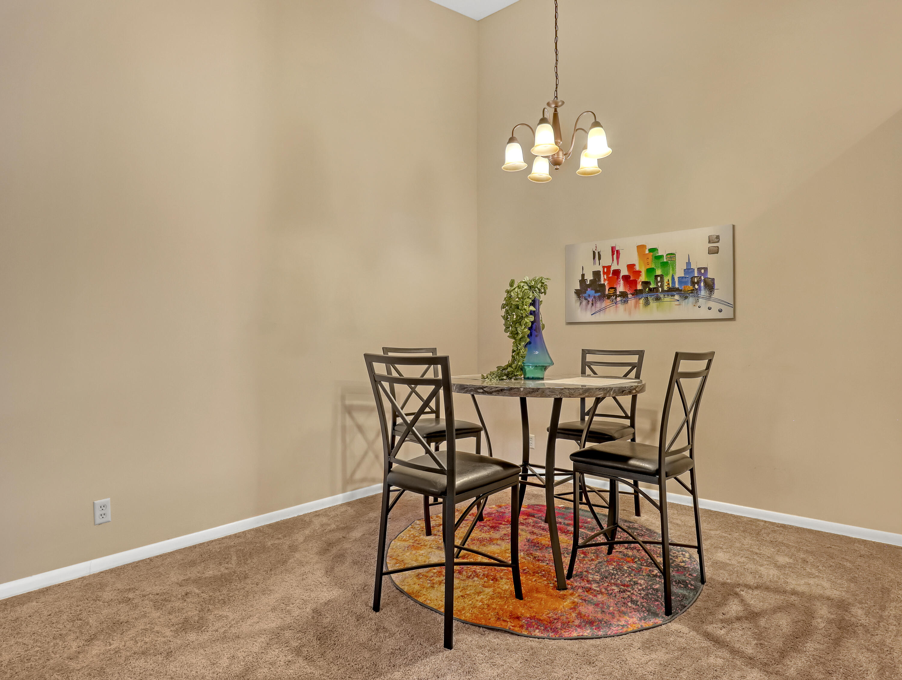 6552 Chasewood Drive, Unit H Jupiter, FL 33458 - Photo 13 of 33 a view of a dining room with furniture and chandelier