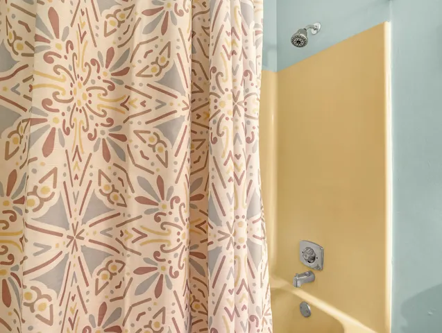 a bathroom with a shower curtain