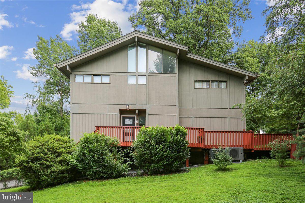 7614 Carteret Road Bethesda, MD 20817 - Photo 2 of 31 Contemporary home nestled in lush greenery.