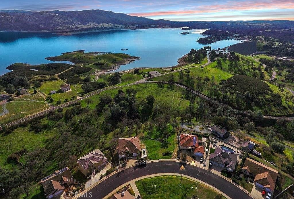 1121 Paradise Peak Road Valley Springs, CA 95252 - Photo 1 of 10 a view of a lake with a city