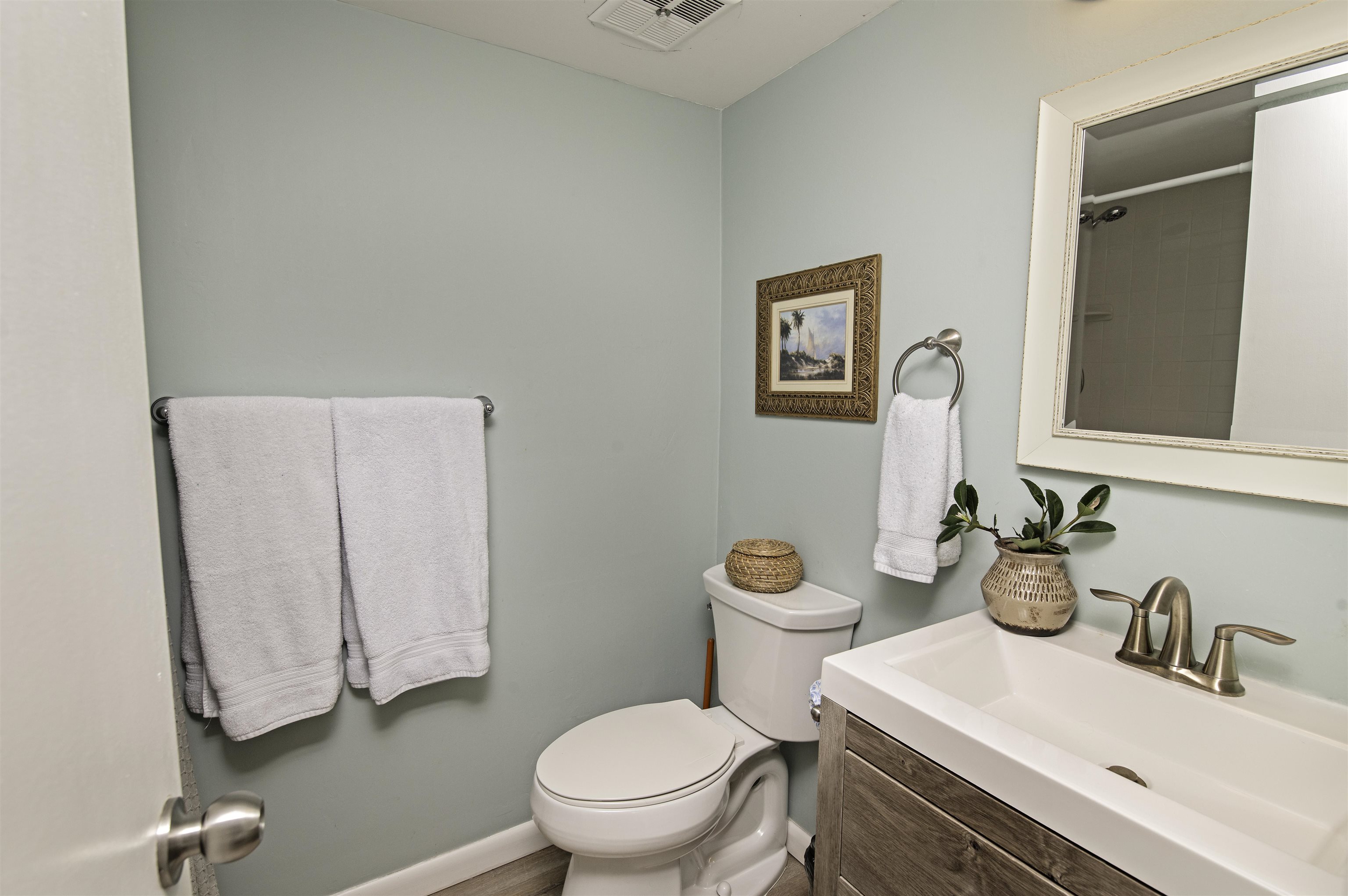 4 Ocean Trace Road, Unit 119 St. Augustine, FL 32080 - Photo 16 of 35 a bathroom with a sink vanity mirror and toilet