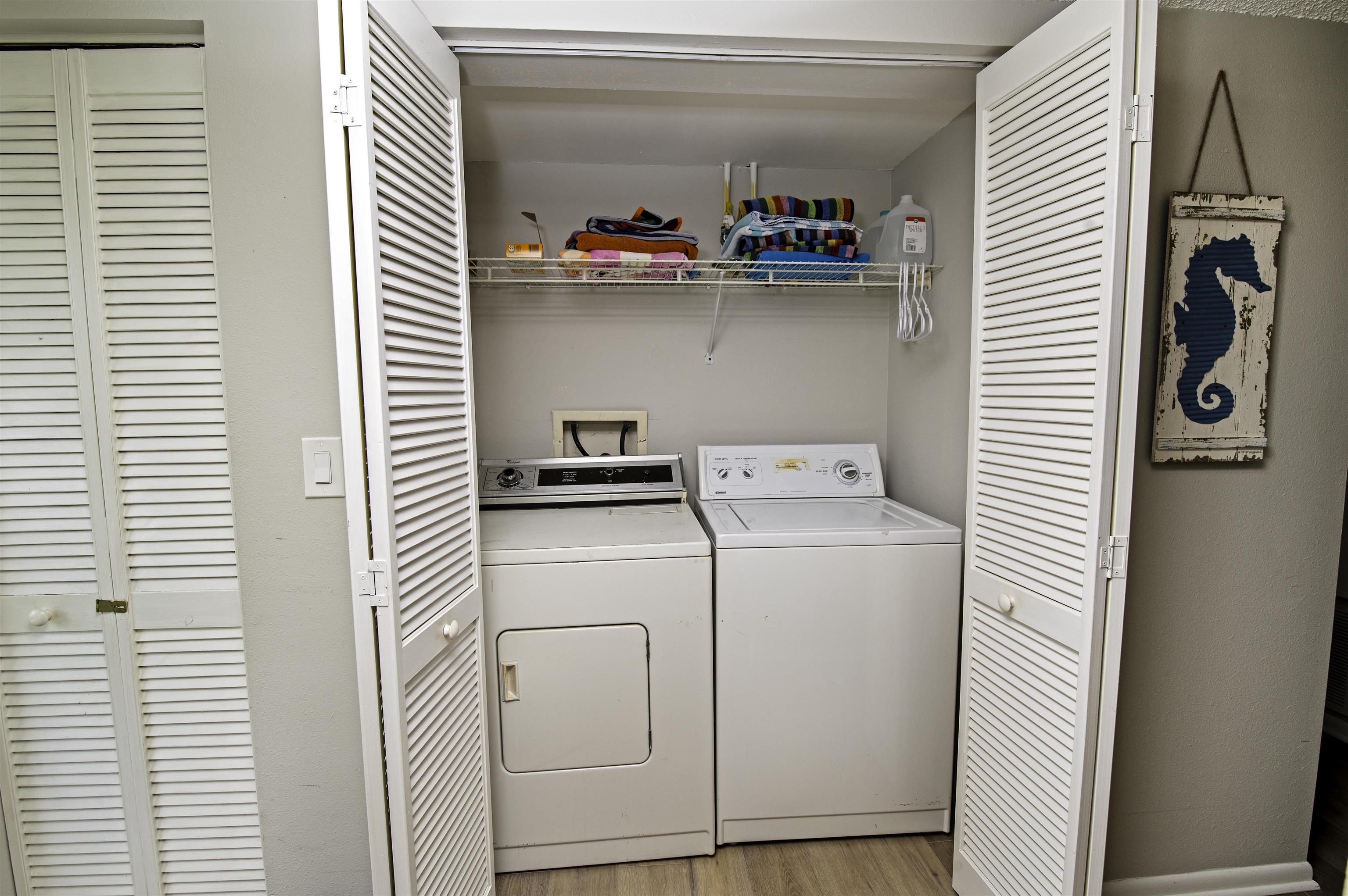 4 Ocean Trace Road, Unit 119 St. Augustine, FL 32080 - Photo 21 of 35 a utility room with dryer and washer