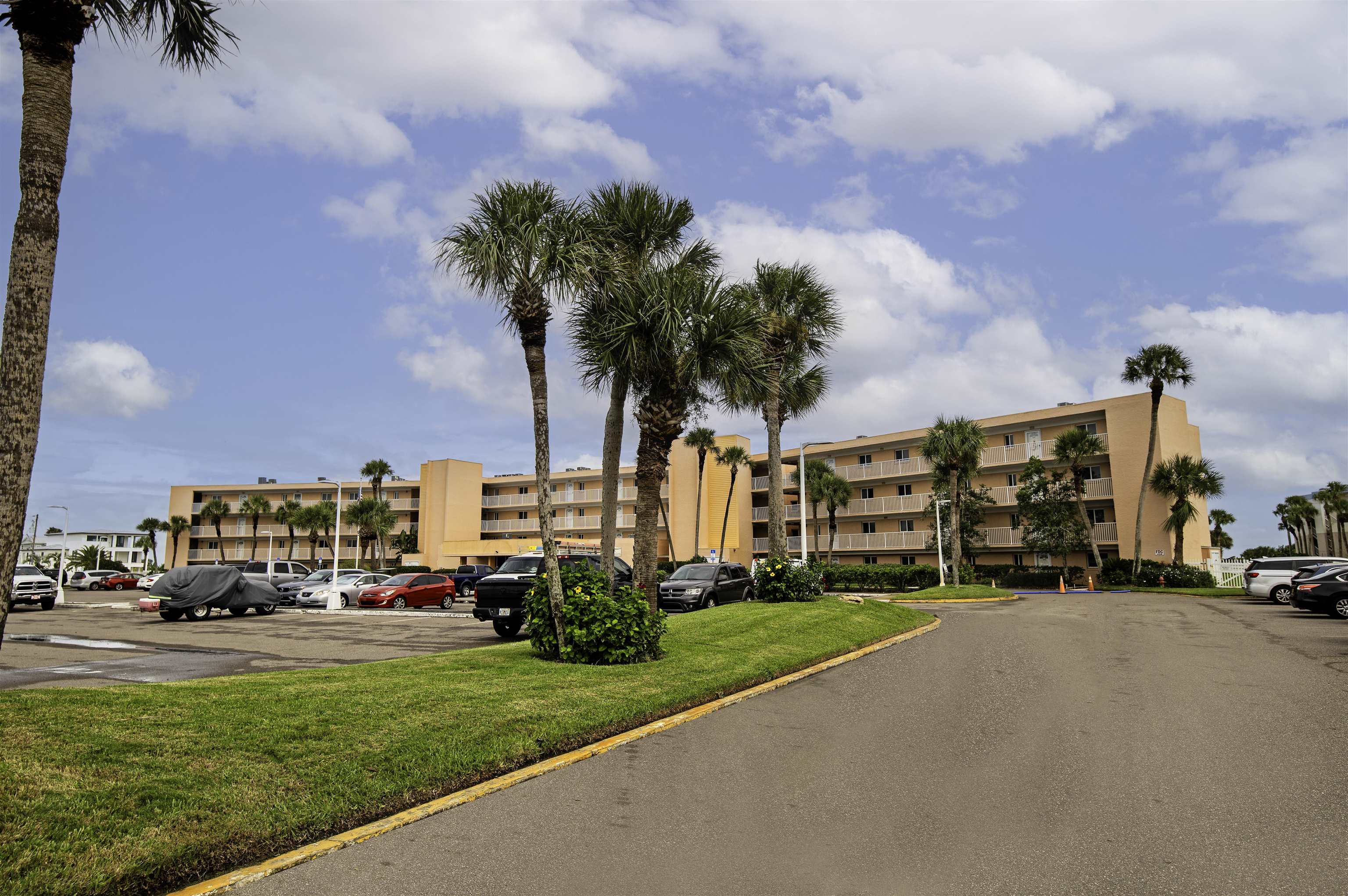 4 Ocean Trace Road, Unit 119 St. Augustine, FL 32080 - Photo 25 of 35 a car parked in front of a house with a big yard