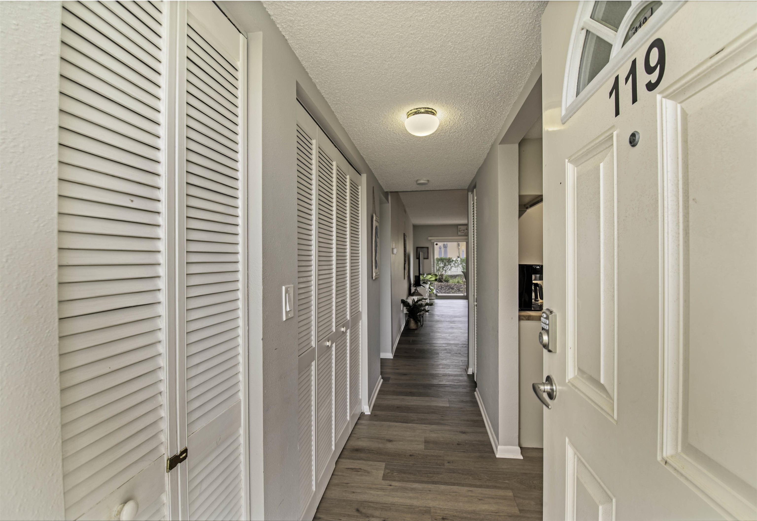 4 Ocean Trace Road, Unit 119 St. Augustine, FL 32080 - Photo 35 of 35 a view of a hallway with a wooden door