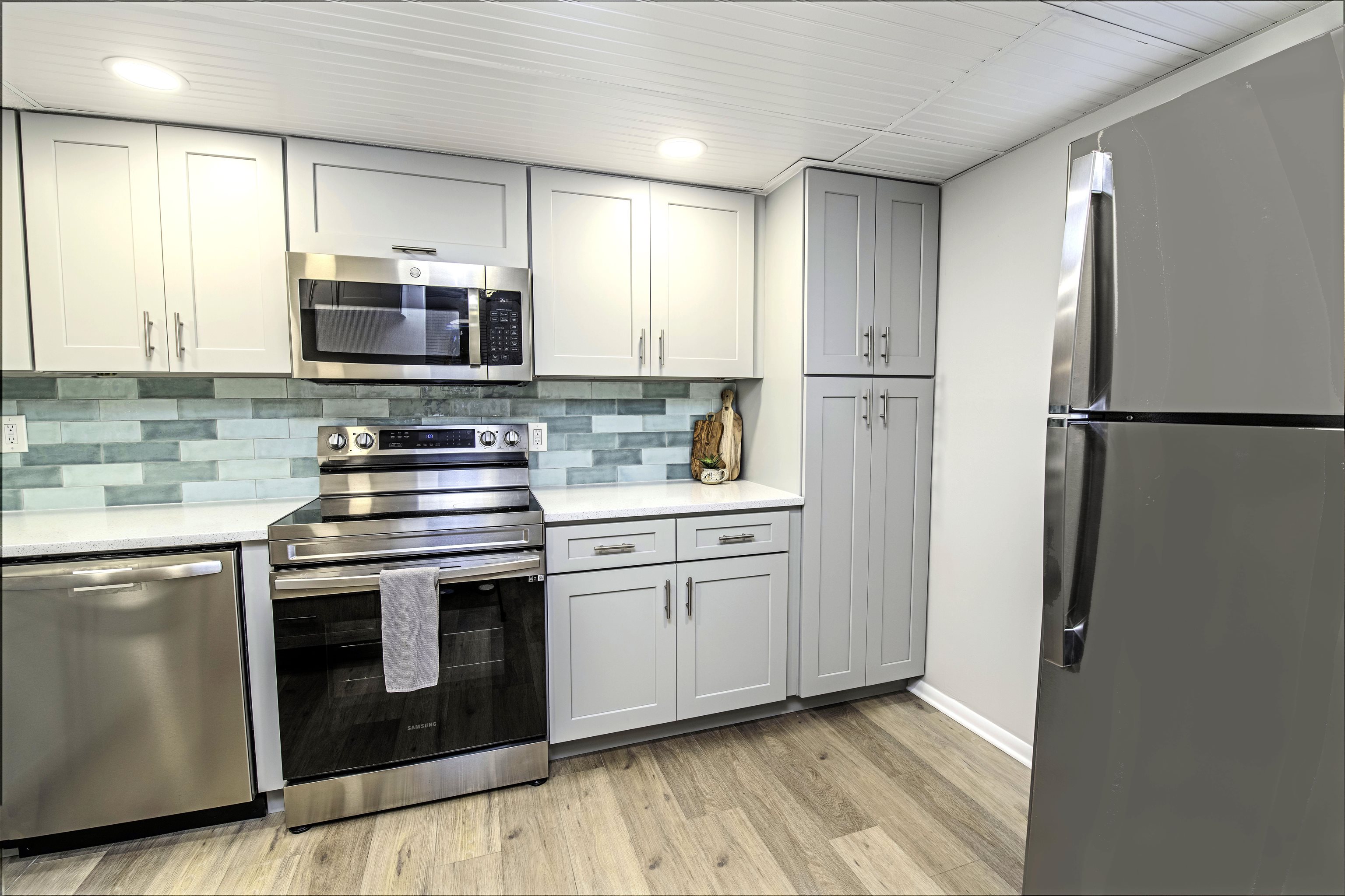 4 Ocean Trace Road, Unit 119 St. Augustine, FL 32080 - Photo 4 of 35 a kitchen with stainless steel appliances a refrigerator sink and microwave