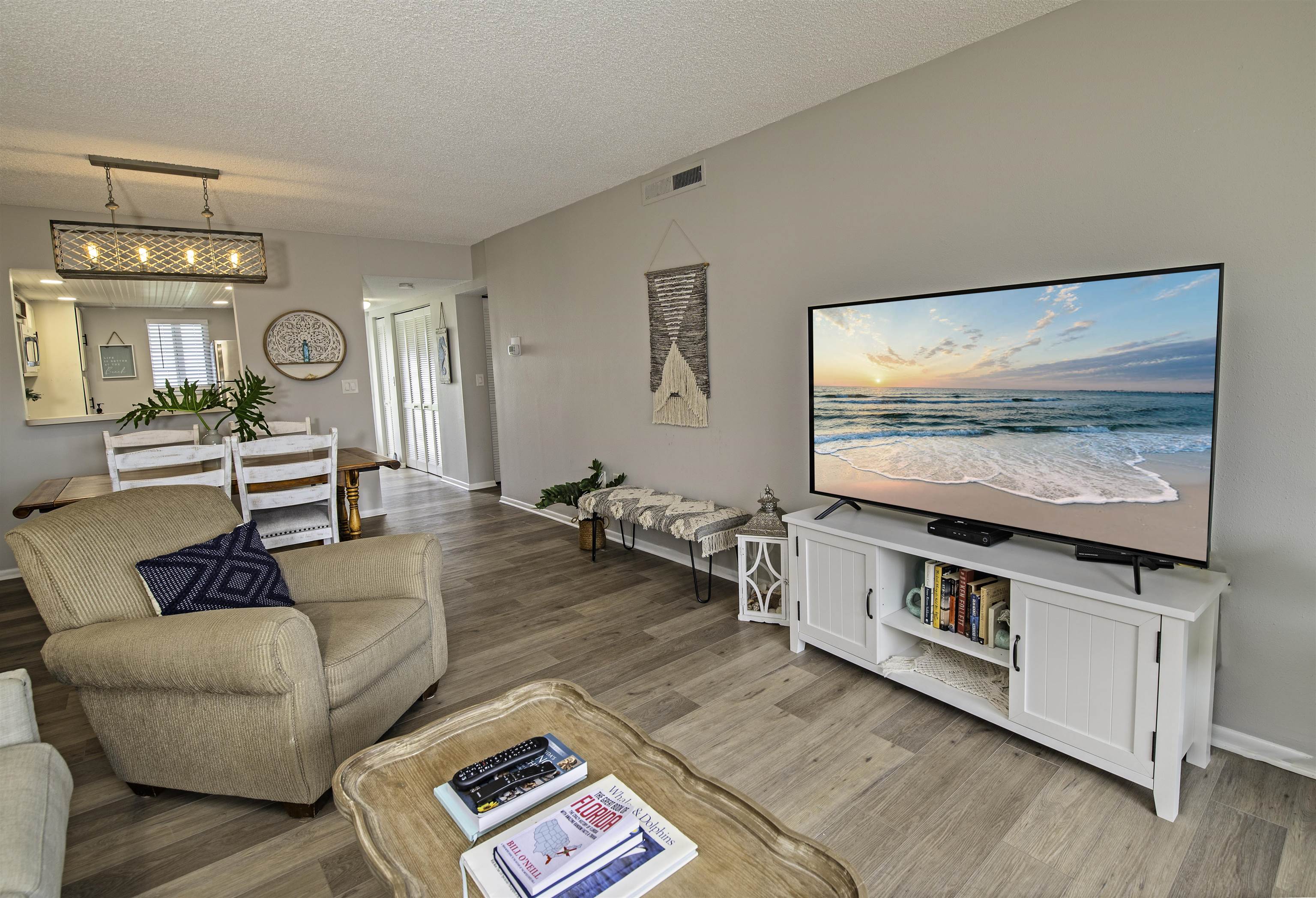 4 Ocean Trace Road, Unit 119 St. Augustine, FL 32080 - Photo 8 of 35 a living room with furniture and a flat screen tv
