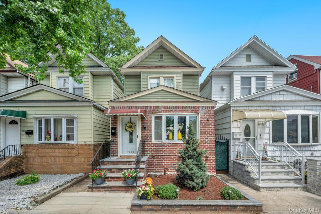 89-13 84th Street Queens, NY 11421 - Photo 1 of 34 Brick and siding facade with bay window and gabled roofline