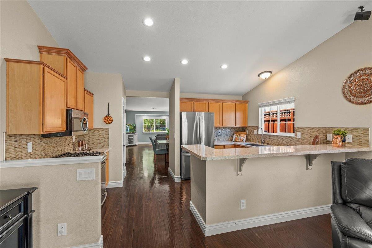5442 Mesa Road Gilroy, CA 95020 - Photo 11 of 26 a kitchen with a sink stove and wooden cabinets