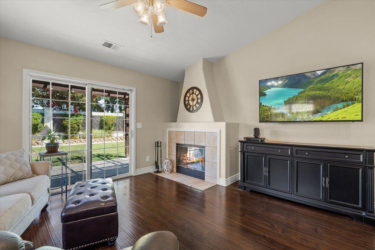 5442 Mesa Road Gilroy, CA 95020 - Photo 13 of 26 a living room with furniture fireplace and flat screen tv