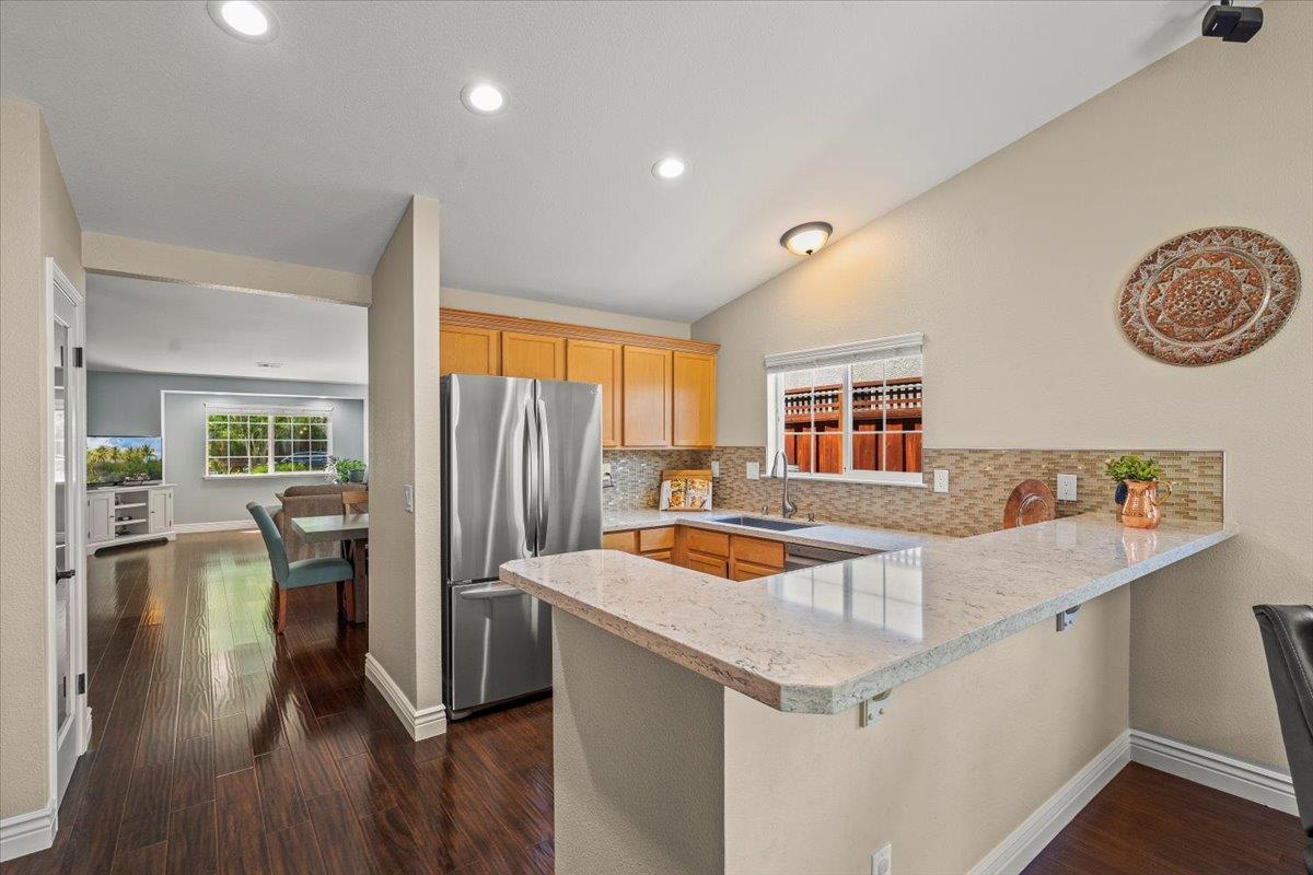 5442 Mesa Road Gilroy, CA 95020 - Photo 10 of 26 a kitchen that has a cabinets a sink a stove and wooden floor