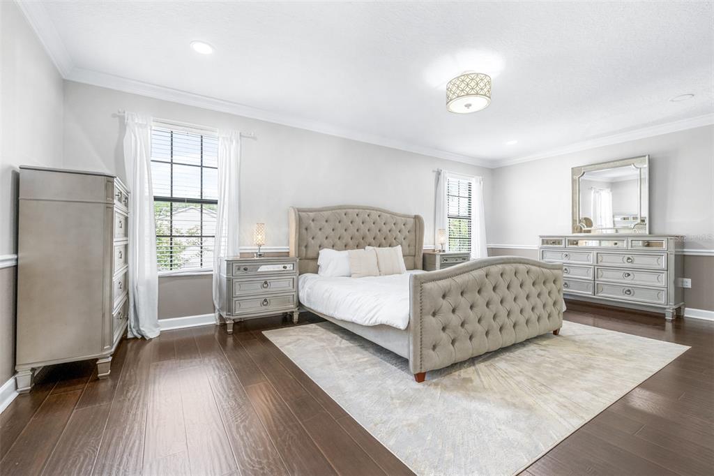 1762 Hadden Hall Place Trinity, FL 34655 - Photo 19 of 49 a bedroom with a bed and a large window