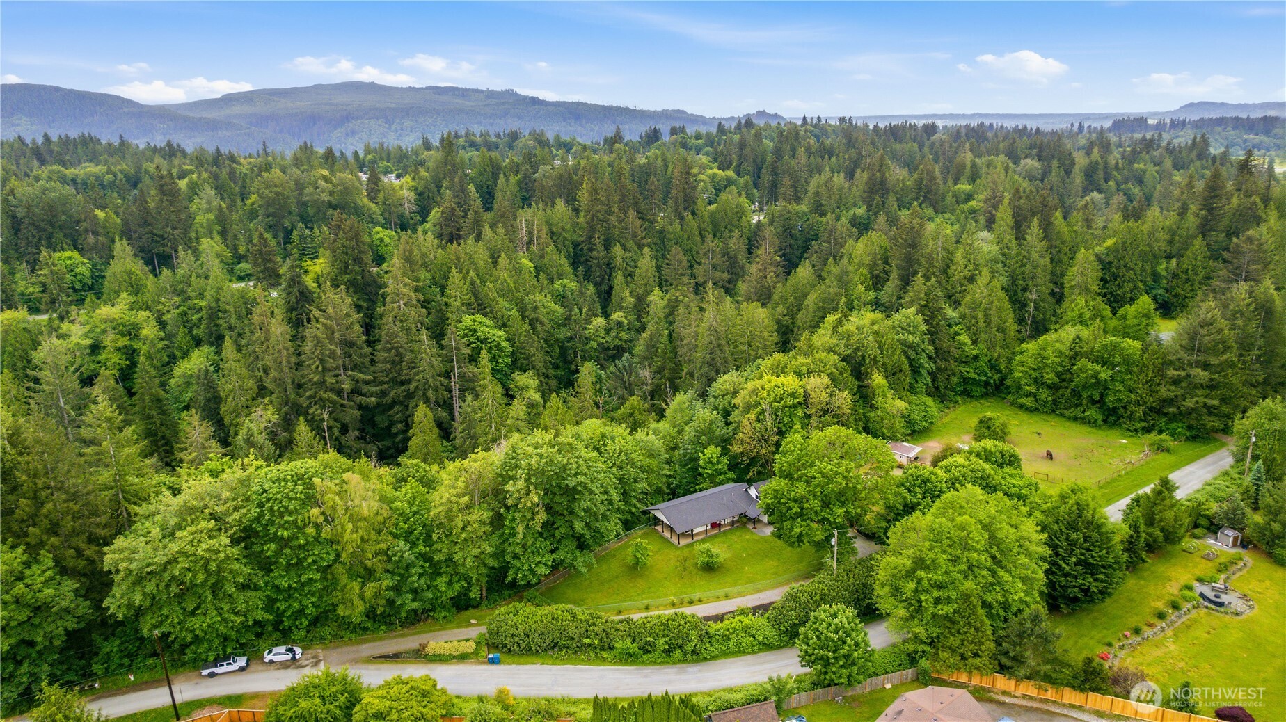 24522 Cromwell Road Monroe, WA 98272 - Photo 35 of 40 a view of a city and lush green forest