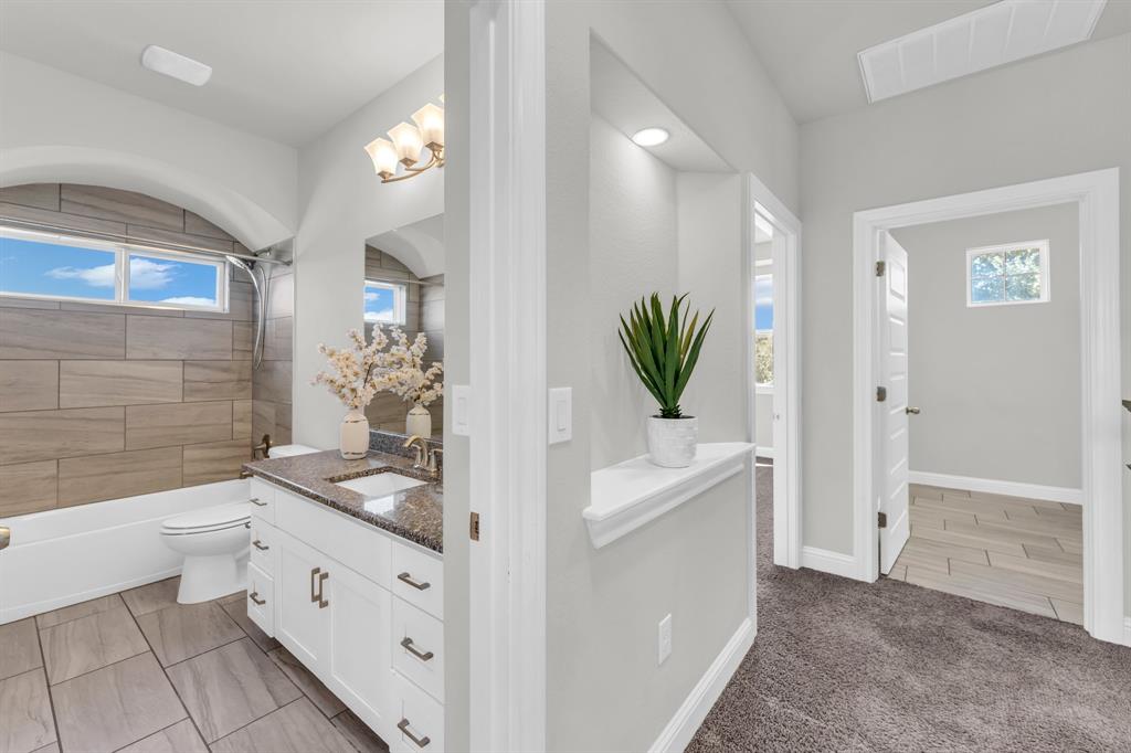 110 Magona Trail Georgetown, TX 78628 - Photo 21 of 38 Well-appointed bath featuring a spacious vanity and sleek tile flooring.
