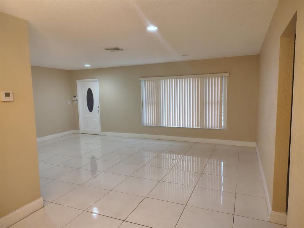 7101 Northwest 97th Avenue Tamarac, FL 33321 - Photo 5 of 23 a view of an empty room with a window