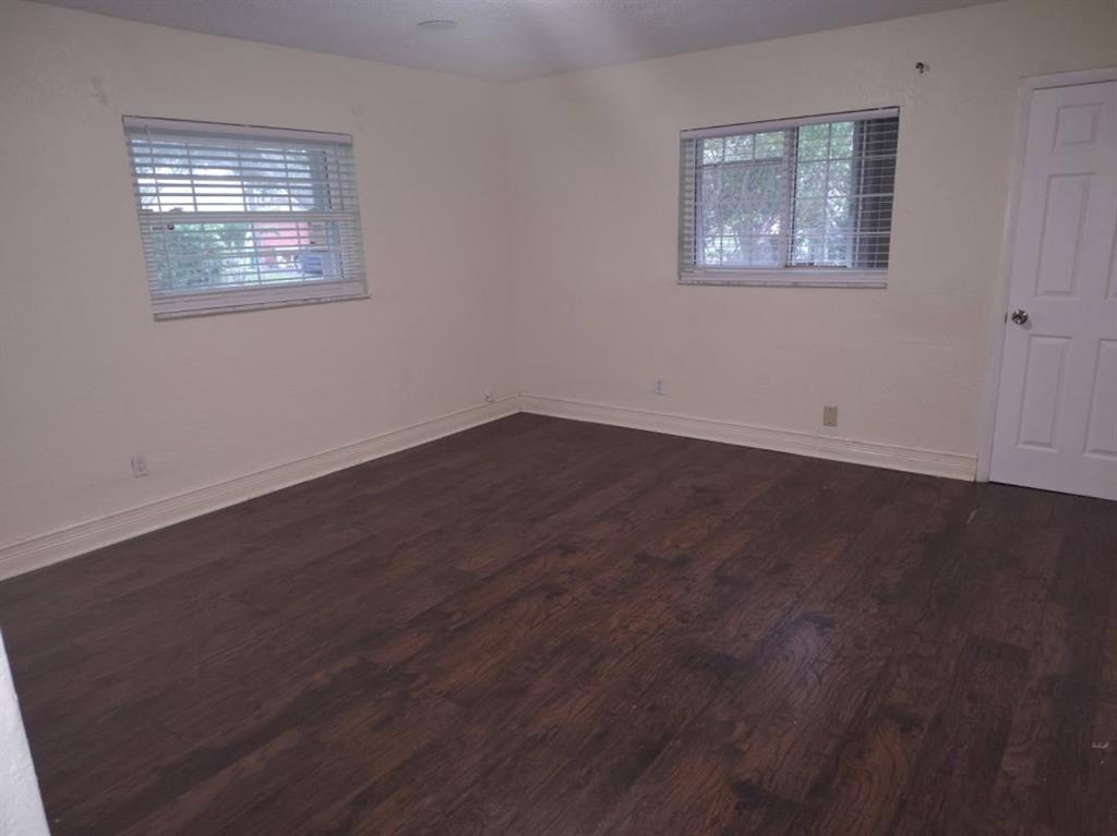 7101 Northwest 97th Avenue Tamarac, FL 33321 - Photo 9 of 23 a view of an empty room with wooden floor and a window