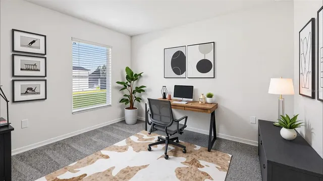 a workspace with furniture and a potted plant