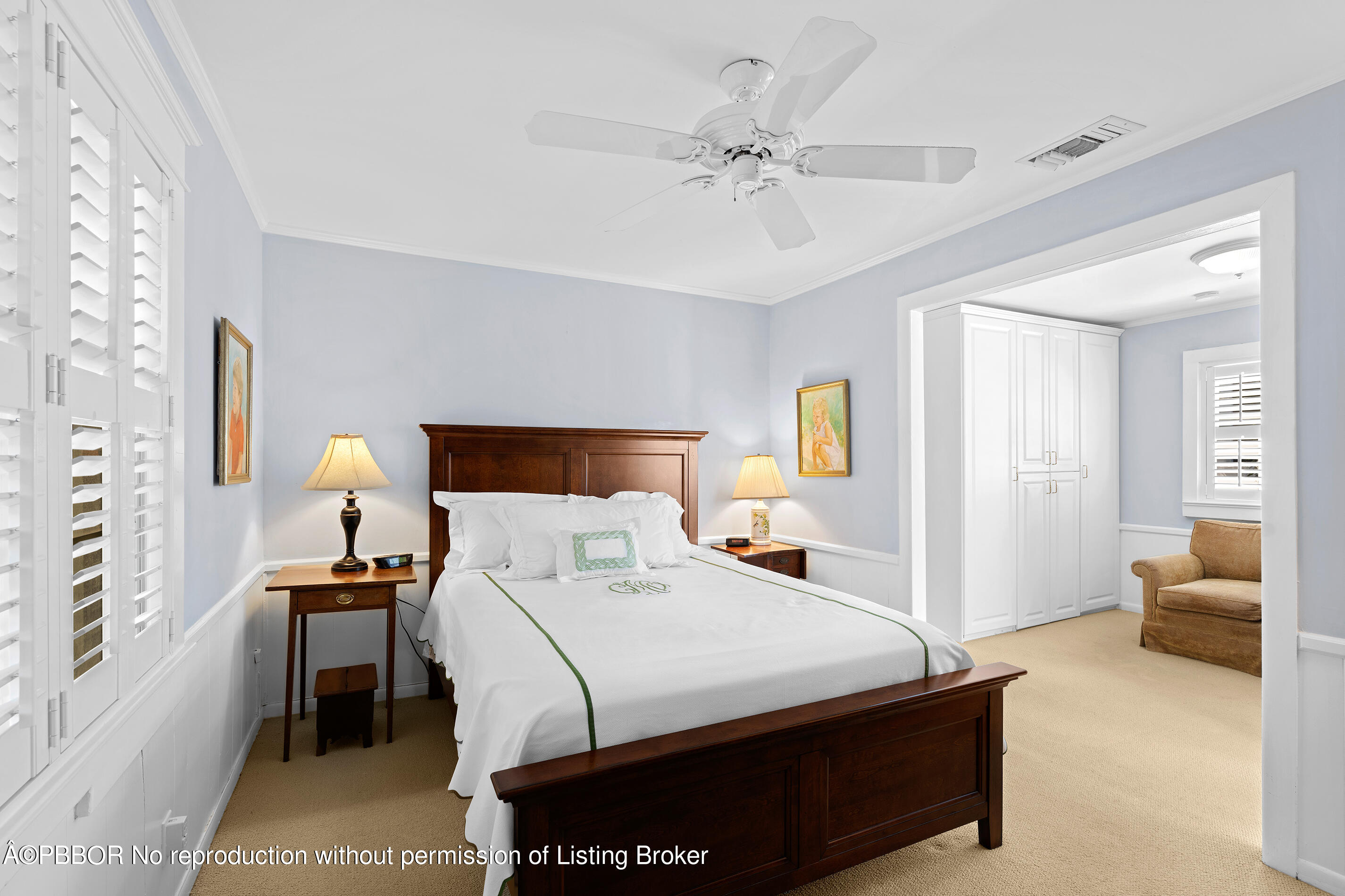 225 South County Road Palm Beach, FL 33480 - Photo 12 of 22 a bedroom with a bed and a chandelier
