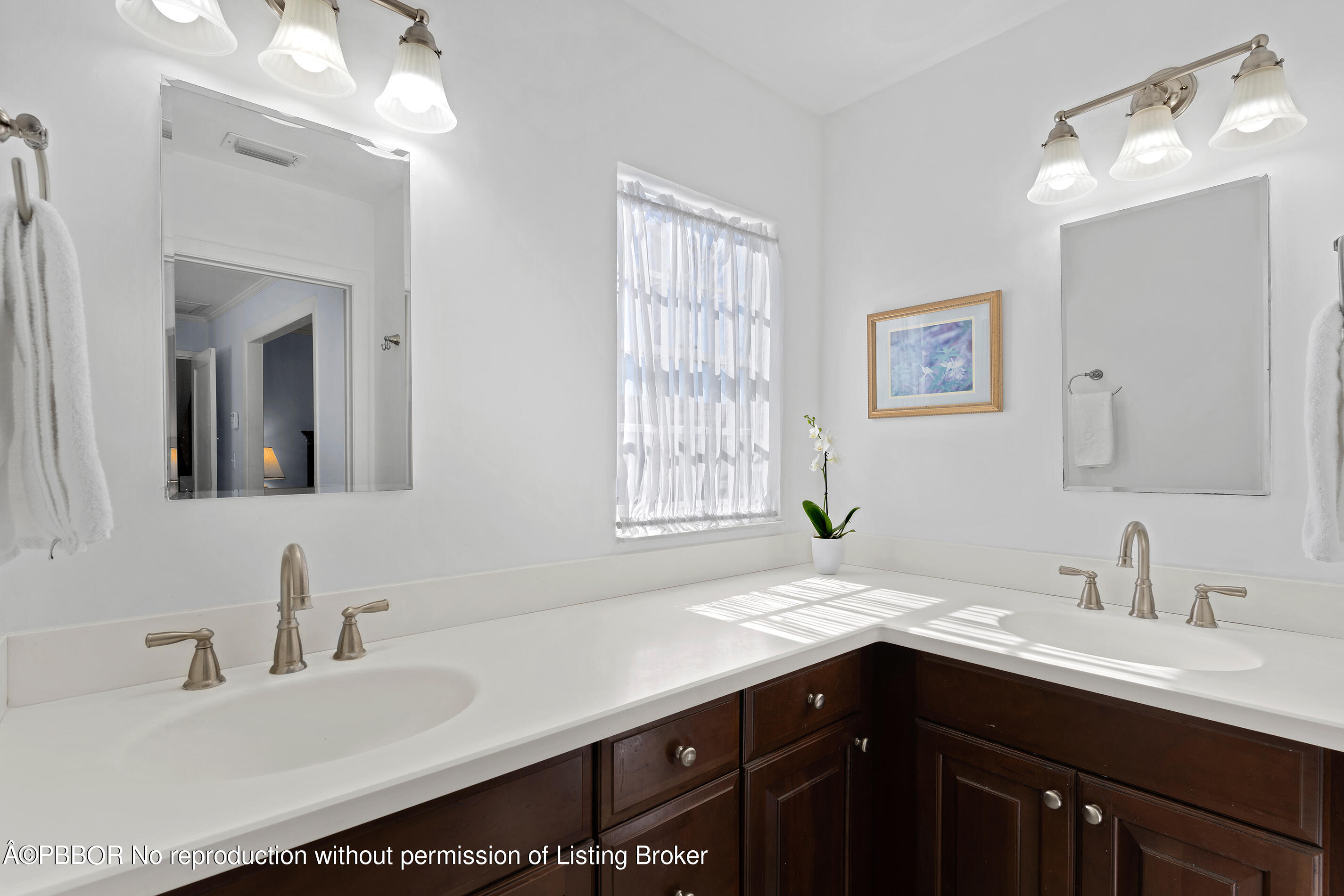 225 South County Road Palm Beach, FL 33480 - Photo 13 of 22 a bathroom with a sink double vanity and a mirror