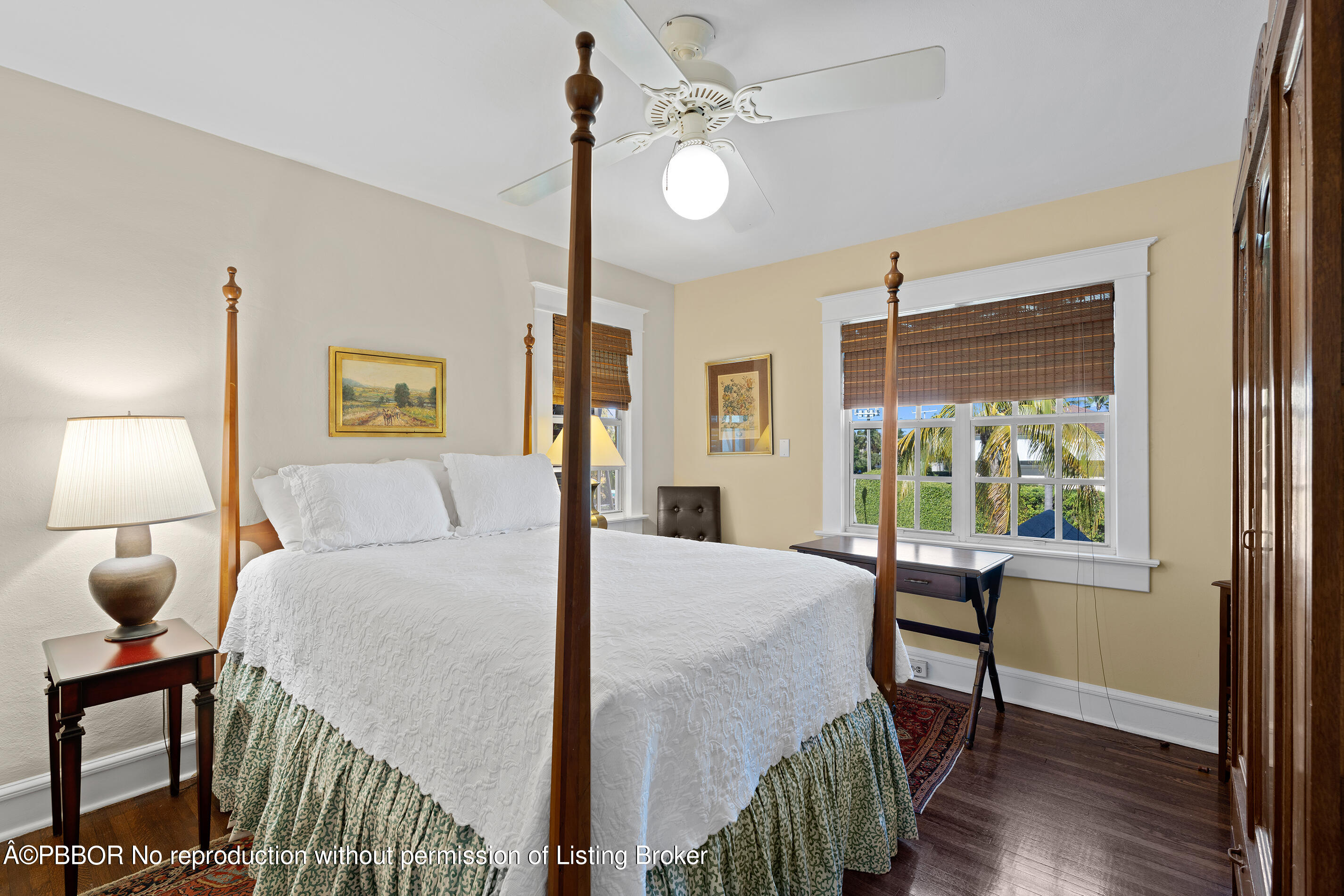225 South County Road Palm Beach, FL 33480 - Photo 14 of 22 a bedroom with a bed a chandelier and window