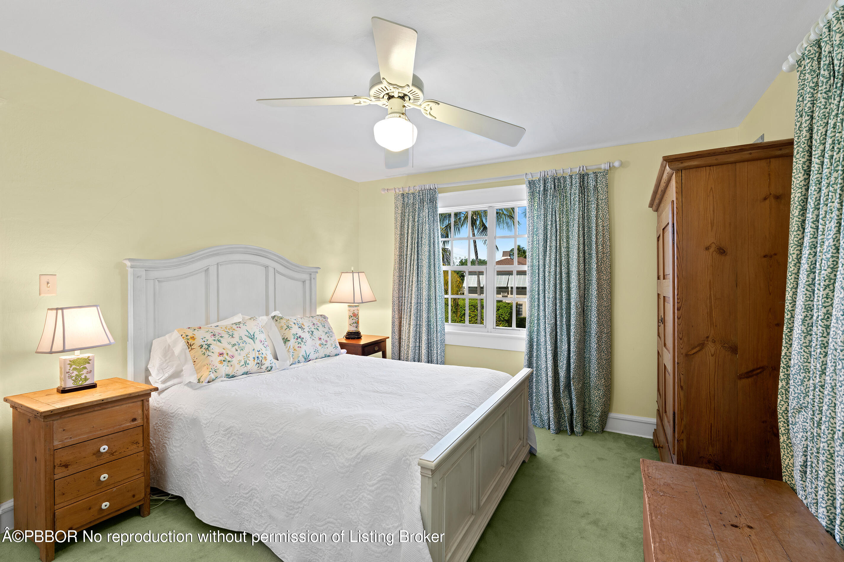 225 South County Road Palm Beach, FL 33480 - Photo 15 of 22 a bedroom with a bed and a chandelier