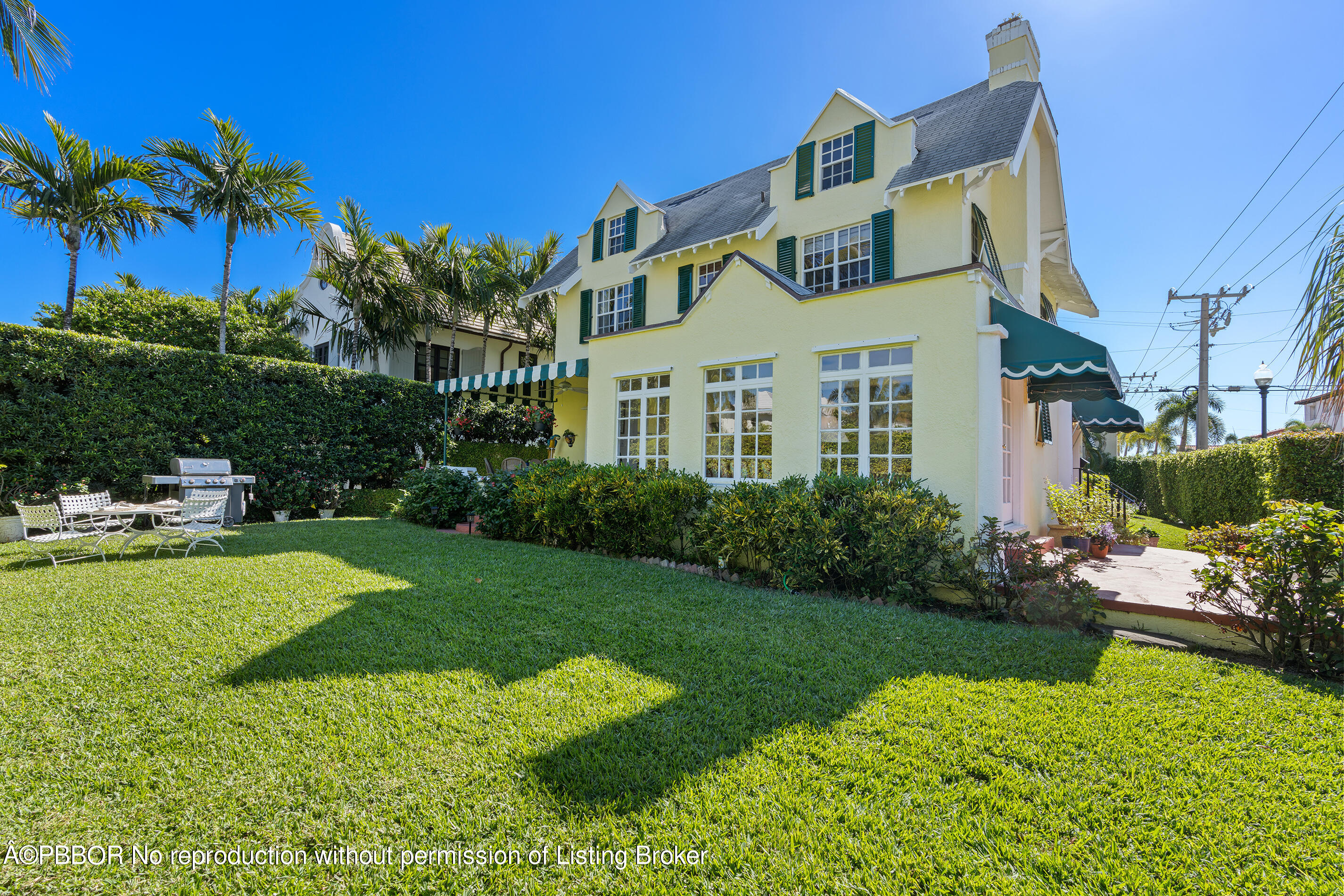 225 South County Road Palm Beach, FL 33480 - Photo 2 of 22 a front view of a house with garden
