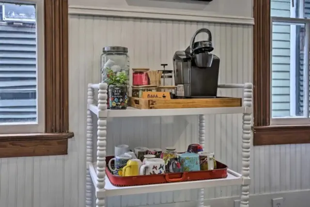 a kitchen with cabinets appliances a sink and a window