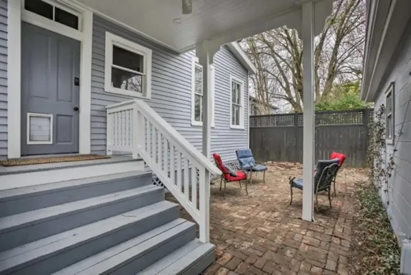 a backyard of a house with seating space