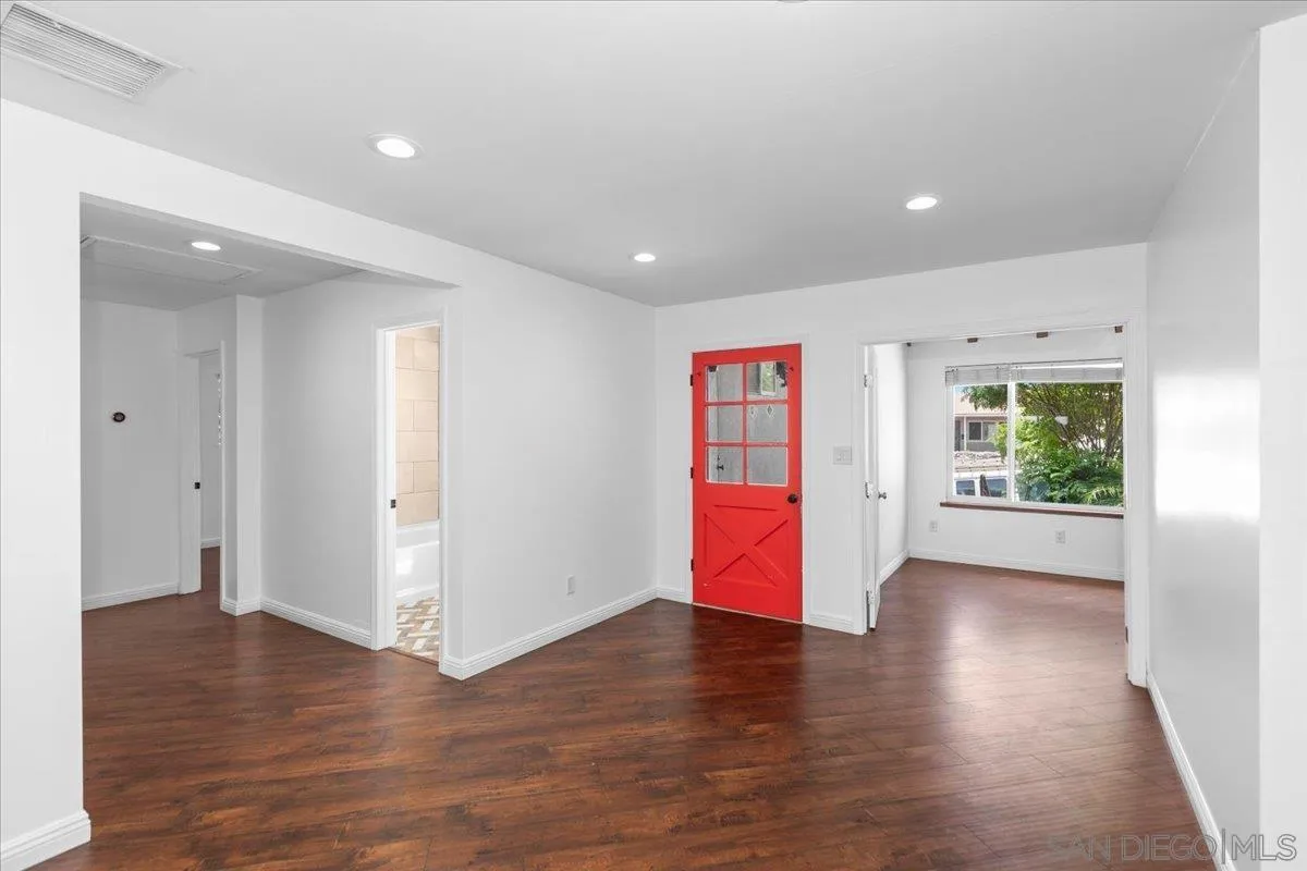9307 Dalehurst Road Santee, CA 92071 - Photo 11 of 46 a view of an empty room with wooden floor and a window