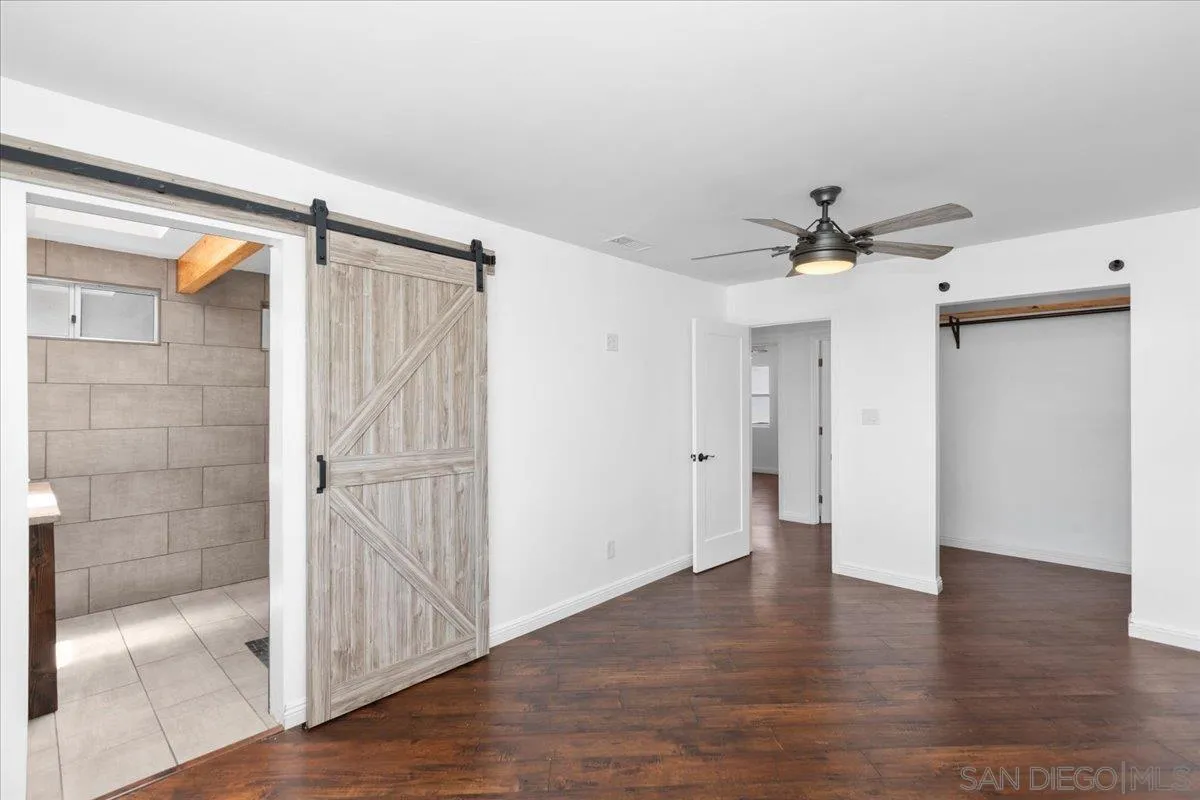 9307 Dalehurst Road Santee, CA 92071 - Photo 17 of 46 a view of empty room with wooden floor and fan