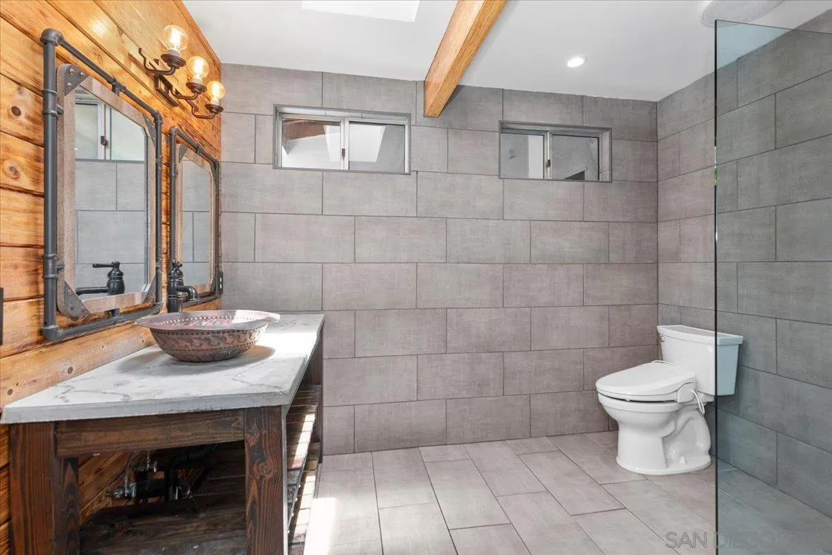 9307 Dalehurst Road Santee, CA 92071 - Photo 18 of 46 a bathroom with a toilet and a sink