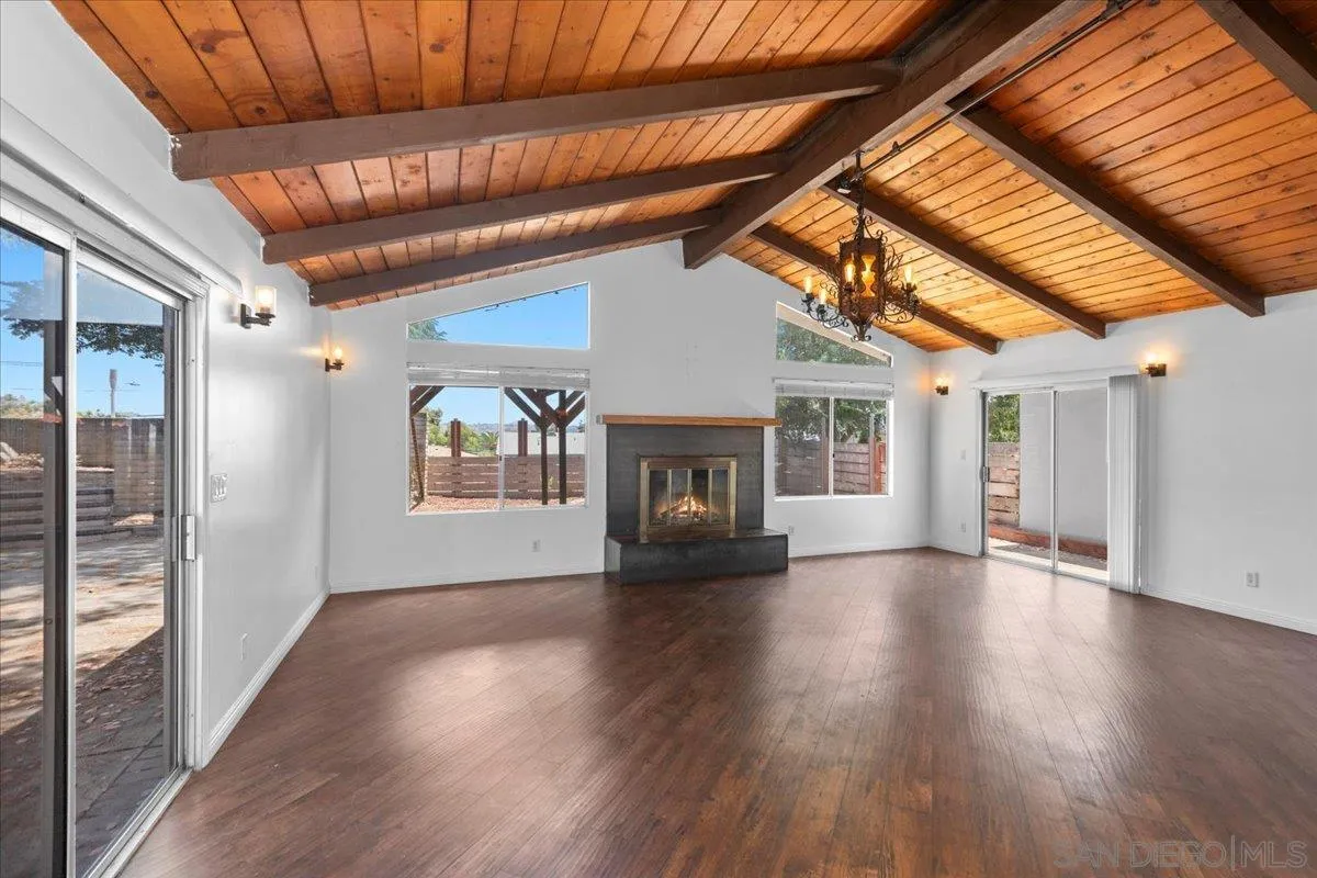 9307 Dalehurst Road Santee, CA 92071 - Photo 2 of 46 a view of an empty room with wooden floor and a window