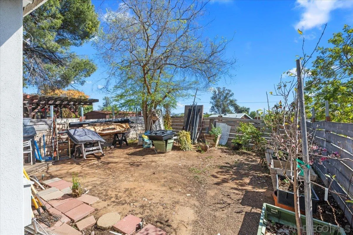 9307 Dalehurst Road Santee, CA 92071 - Photo 21 of 46 a view of a patio with table and chairs and potted plants