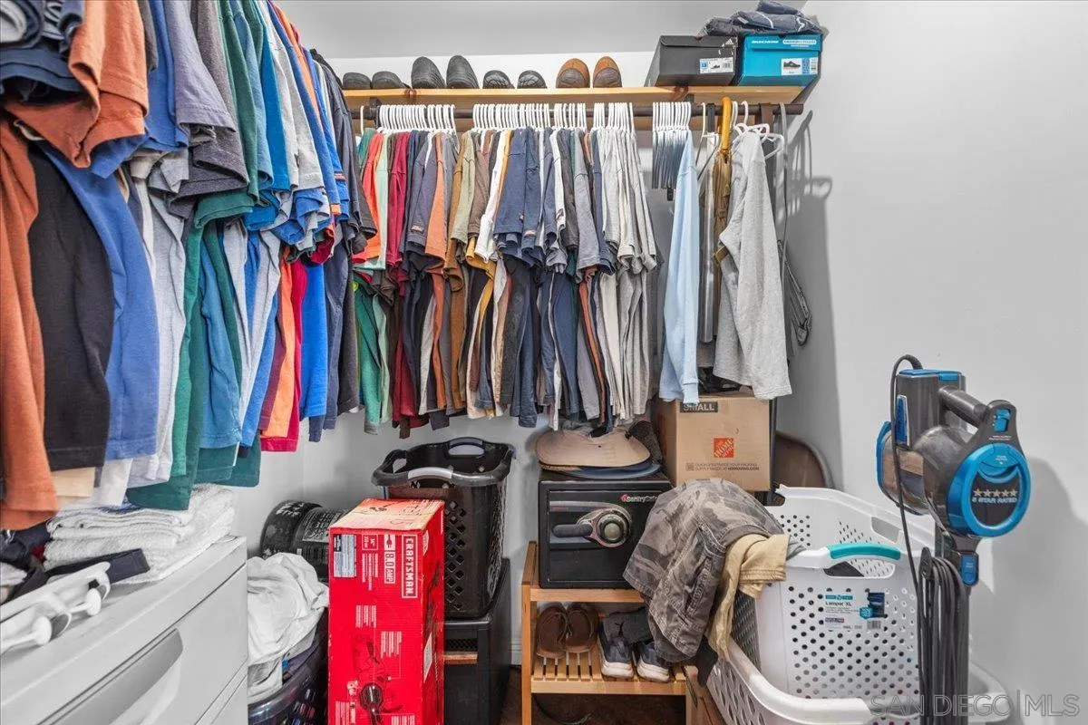 9307 Dalehurst Road Santee, CA 92071 - Photo 28 of 46 a view of walk in closet with clothes