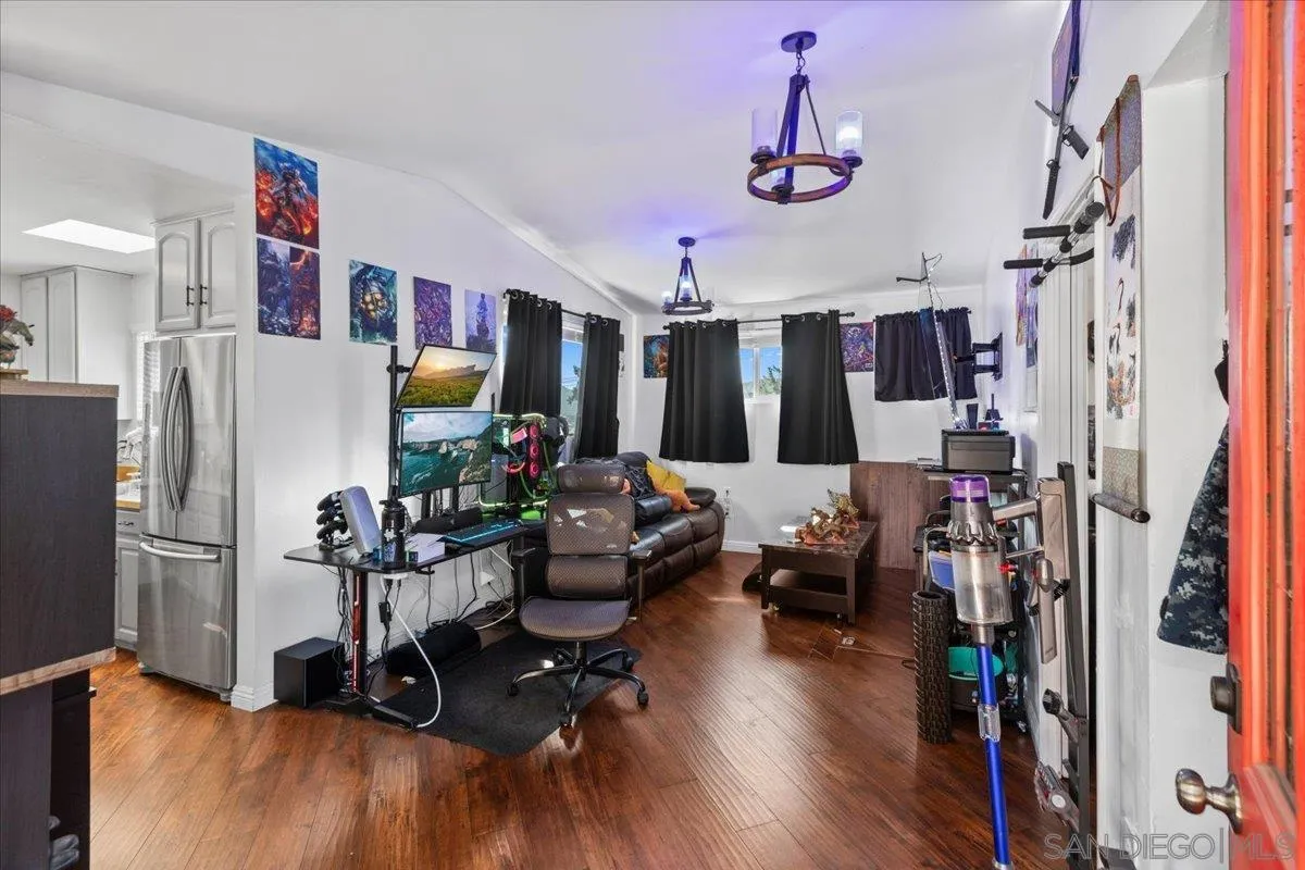 9307 Dalehurst Road Santee, CA 92071 - Photo 31 of 46 a living room with lots of furniture and a flat screen tv