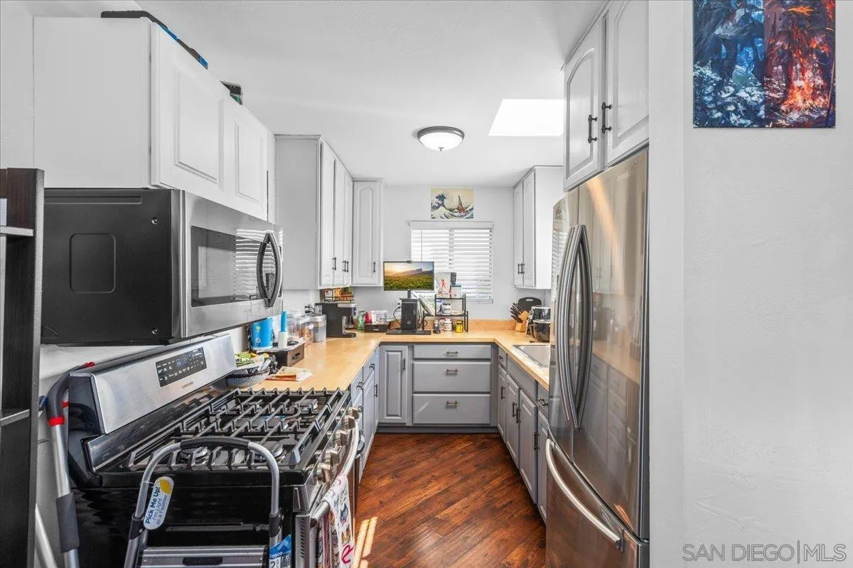 9307 Dalehurst Road Santee, CA 92071 - Photo 32 of 46 a kitchen with stainless steel appliances a refrigerator stove and sink