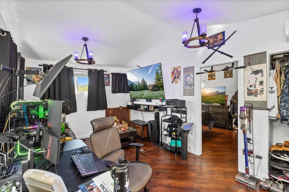 9307 Dalehurst Road Santee, CA 92071 - Photo 33 of 46 a living room filled with furniture and a chandelier