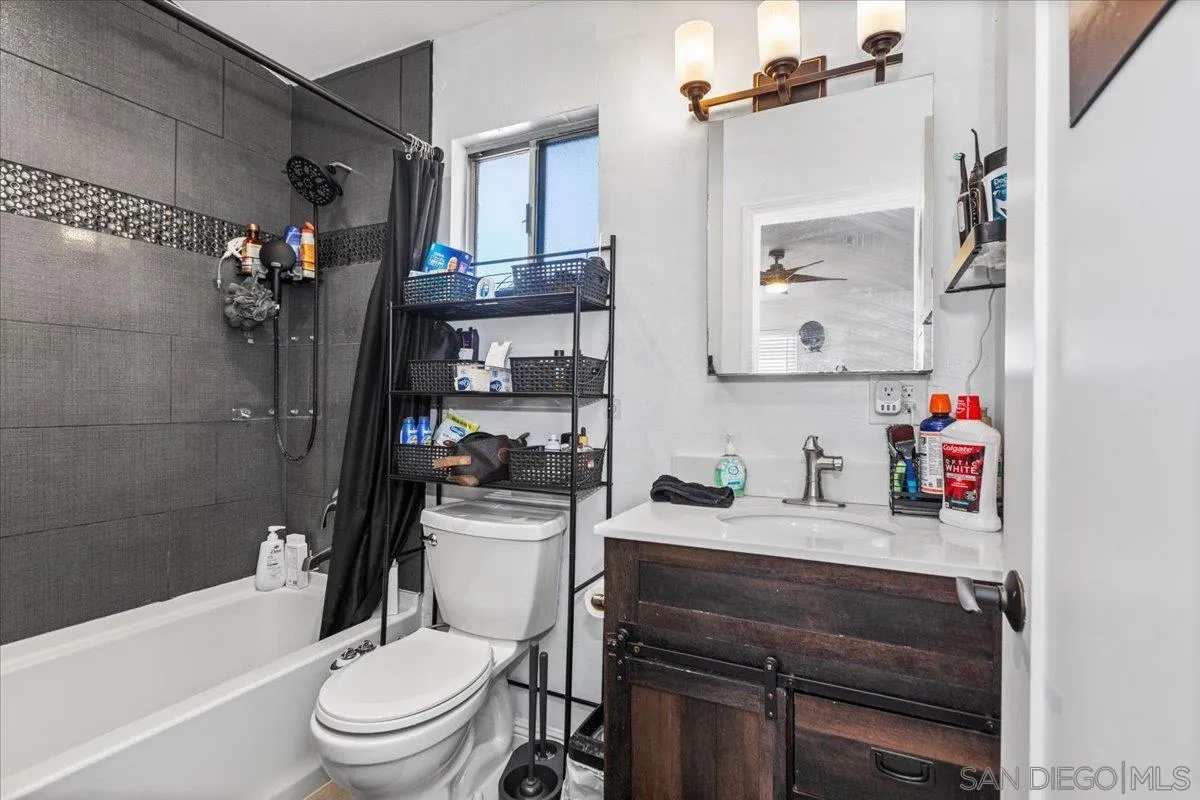 9307 Dalehurst Road Santee, CA 92071 - Photo 35 of 46 a bathroom with a sink toilet vanity tub and shower