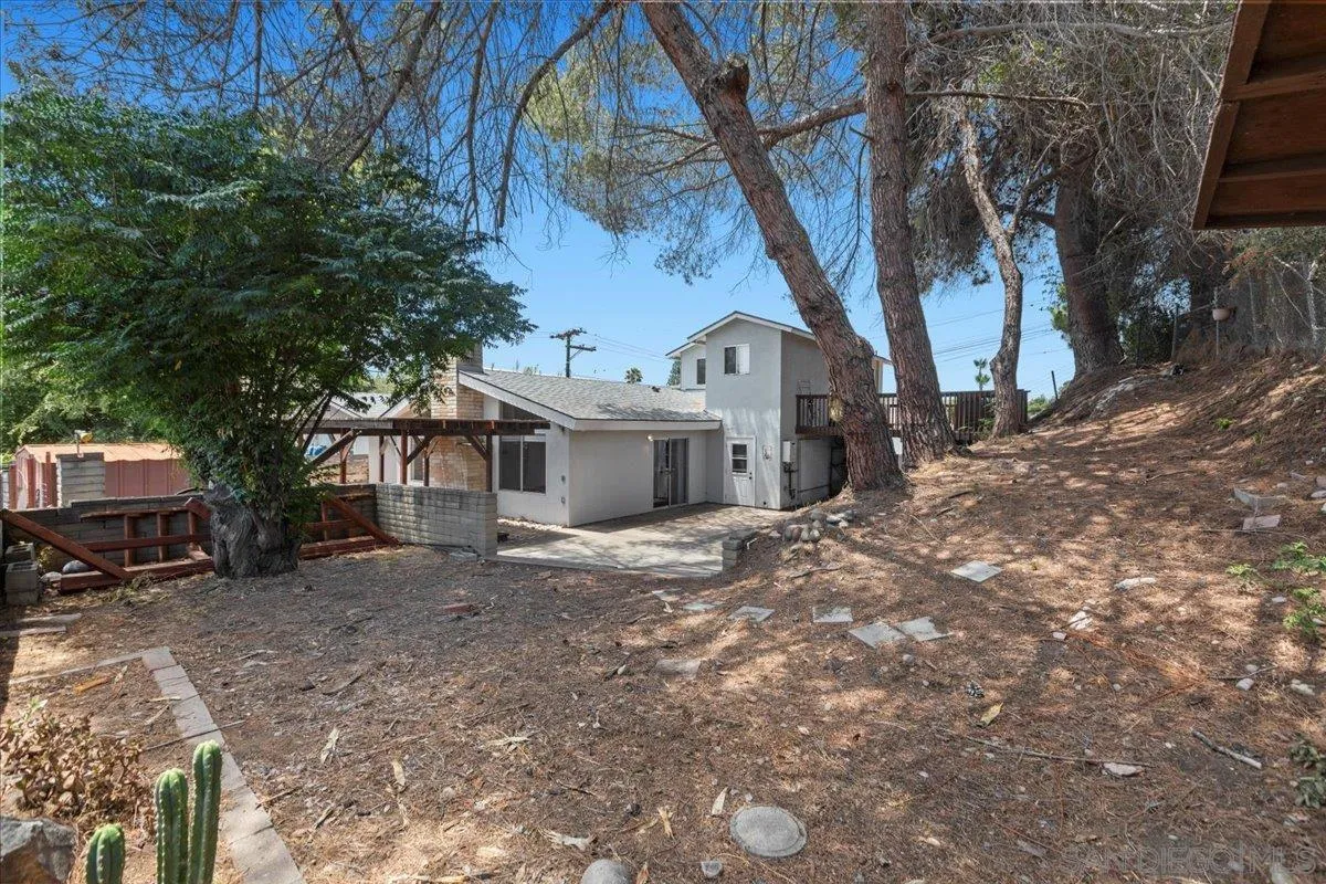 9307 Dalehurst Road Santee, CA 92071 - Photo 38 of 46 a view of a house with a yard and garage