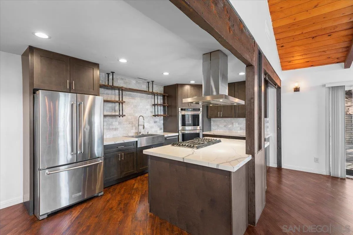 9307 Dalehurst Road Santee, CA 92071 - Photo 6 of 46 a kitchen with stainless steel appliances granite countertop a refrigerator a sink and a stove
