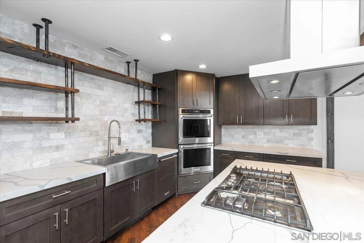 9307 Dalehurst Road Santee, CA 92071 - Photo 8 of 46 a kitchen with a sink stainless steel appliances and cabinets